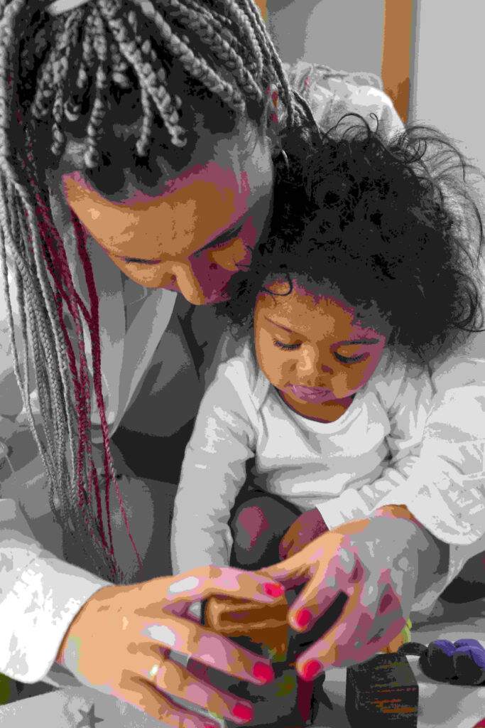 Baby with parents at Little Einstein's Academy infant care program in Edison, NJ