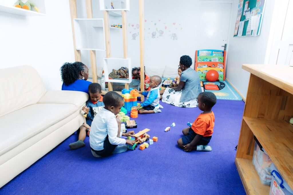 Children playing with toys in a bright daycare classroom near Metuchen NJ