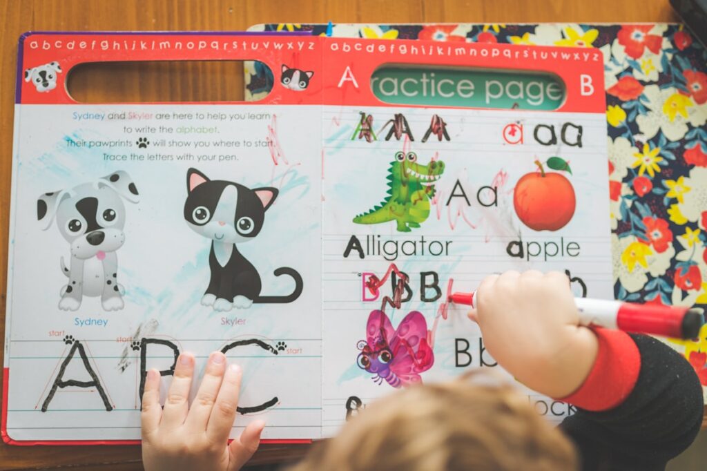 Young boy learning and writing at nursery school near South Plainfield NJ